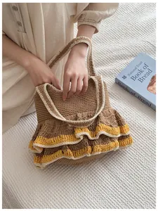 Detailed texture of hand-woven tote bag with brown knit and yellow ruffle trim details