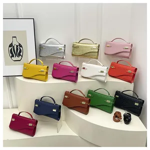 Detail view of woven leather handbags in 12 colors with metal buckles and detachable straps