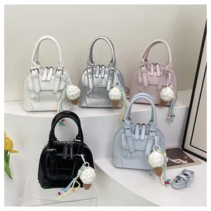Collection of shell-shaped handbags in five colors with woven ice cream charm details