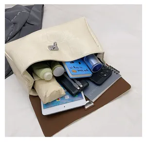 Detailed interior of crocodile pattern shoulder bag showing large storage capacity