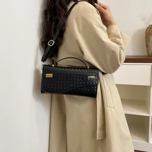 Classic black woven texture handbag with adjustable leather shoulder strap and gold hardware