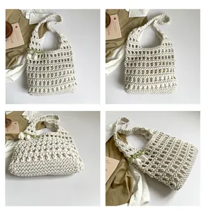 Detail of cream crochet tote bag with woven mesh pattern and green floral ribbon accents