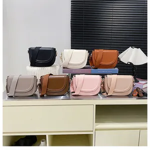 Detailed collection of saddle bags in seven trendy colors with wide woven shoulder straps