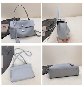 Vues détaillées du sac à main en cuir bleu clair avec fermoir rotatif et rivets