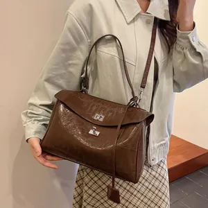 Dark brown crocodile embossed handbag with silver clasp and dual straps for women
