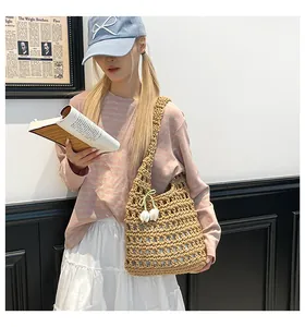 Detail of beige crochet tote bag with tulip floral charm on a casual summer outfit