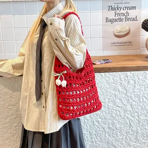 Red woven hollow-out tote bag with lily of the valley charm and large capacity design