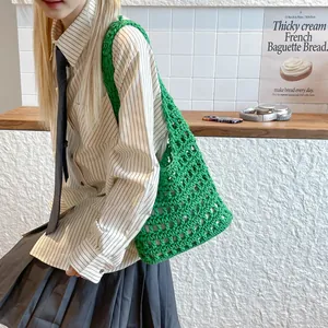Bright green hand-crocheted hollow tote bag with a woven texture for casual styling