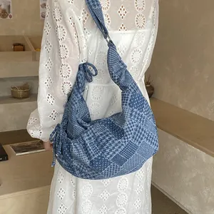 Retro denim patchwork crescent hobo bag with checkered patterns and bow detail