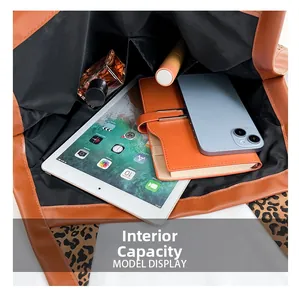 Detailed view of the tote bag internal capacity holding a tablet and daily essentials