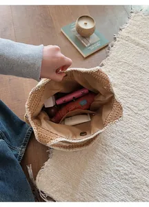 Detail view of large capacity knitted tote bag with magnetic snap closure and inner pocket