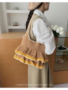 Close-up of vintage knit tote bag showing textured ruffles and mustard yellow trim detail