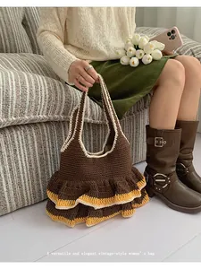 Detailed macro of vintage brown crochet knit handbag with layered ruffle edge design