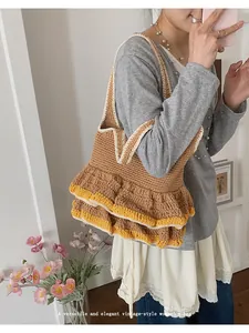 Detailed macro of the tri-color ruffled knit tote bag featuring a vintage crochet texture