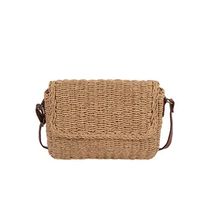 Classic woven straw crossbody bag in natural brown with leather shoulder strap