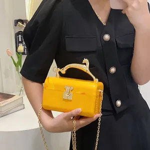 Yellow marble acrylic clutch bag with leopard handle and gold chain strap for women