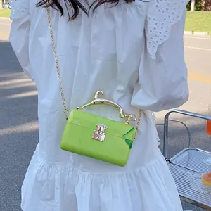 Green marble acrylic box bag with golden bird handle and chain strap for women