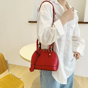 Red crocodile texture shell bag with top handles and adjustable shoulder strap for women