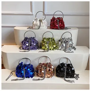 Detailed display of sequined bucket bags in eight vibrant colors with metal chain tassels