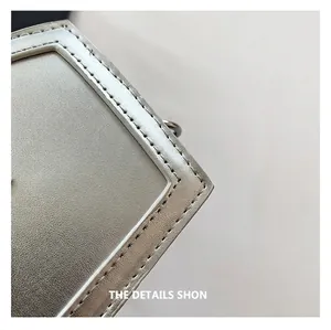Macro shot of silver chain bag showcasing premium textured leather and precise stitching