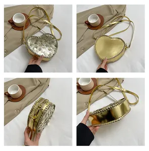Detail of heart-shaped gold sequin bag with woven edges and adjustable strap