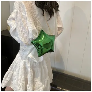 Chic star-shaped crossbody bag in metallic green with elegant gold chain strap detail