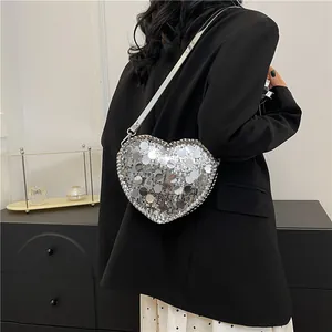 Sparkly silver sequin heart-shaped shoulder bag with metallic chain trim for women