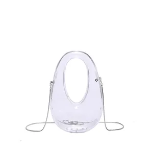 Bolso ovalado transparente de acrílico con cadena de metal plateado para mujer
