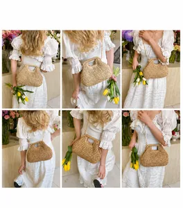 Detail view of woven straw shoulder bag with chain strap and top handle for beach vacations