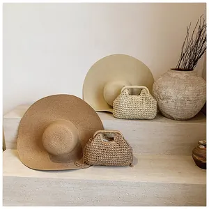 Detail of bohemian straw sun hats and crochet shoulder bags on stone steps