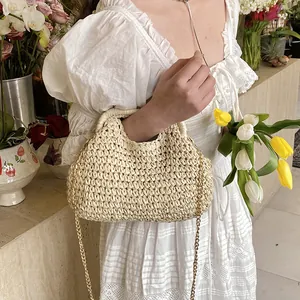 Beige straw woven shell bag with gold chain strap for women, elegant beach vacation style