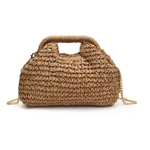 Brown straw woven dumpling bag with elegant gold chain strap for beach vacation