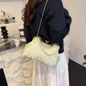 Elegant New Chinese shell bag with floral jacquard, pearl handle and golden chain strap