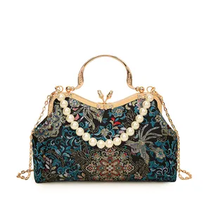 Sac à main bleu brodé de fleurs avec poignée en perles et chaîne en métal doré