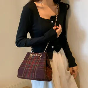 British vintage plaid bucket bag with gold chain strap in classic tartan pattern