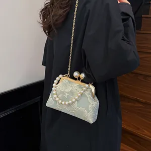 New Chinese shell bag with floral jacquard texture and pearl strap on model back