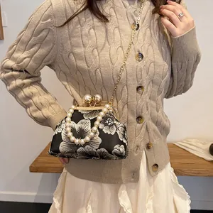 Retro shell-shaped handbag with floral patterns and large pearl handle for early autumn