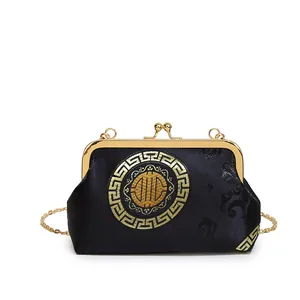 Elegant black silk shell bag with golden embroidery and chain strap for women