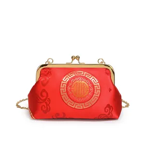 Elegant red silk shell bag with gold auspicious patterns and chain strap