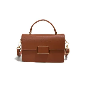 Sac à main minimaliste marron caramel avec grain de litchi et bandoulière amovible