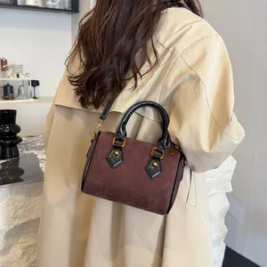 Brown frosted suede Boston bag with quilted embroidery and gold hardware handles