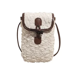 Minimalist beige plush crossbody phone bag with vintage toggle closure and brown trim