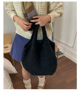 Chic black plush tote bag with fuzzy texture styled for autumn and winter outfits