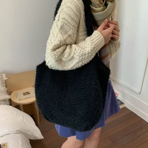Fashionable black faux fur knit tote bag for women with a cozy autumn winter aesthetic