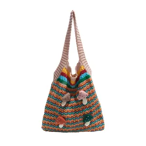 Striped knit tote bag with 3D colorful mushroom accents and pink handles for women