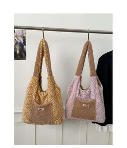 Detailed view of leopard print plush tote bags with soft faux fur texture and pocket