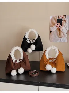 Detail of plush fur trim on winter dumpling bags in black, dark brown, and caramel colors