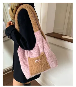 Detail of pink leopard print plush tote bag with lamb wool pocket and Yes Honey label