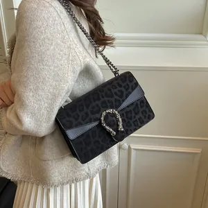 Vintage leopard print crossbody bag with silver tiger head buckle and chain strap