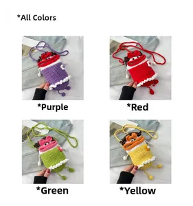 Detail view of handmade knit mini bucket bags in purple red green and yellow colors